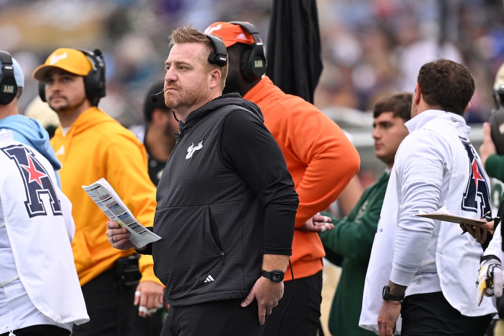 South Florida head coach Alex Golesh, center, during the first half of a NCAA college football...