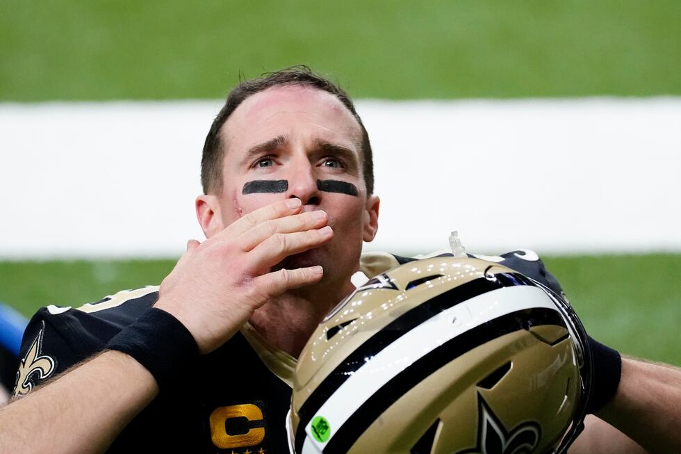 New Orleans Saints quarterback Drew Brees waves to his family and fans after an NFL divisional...