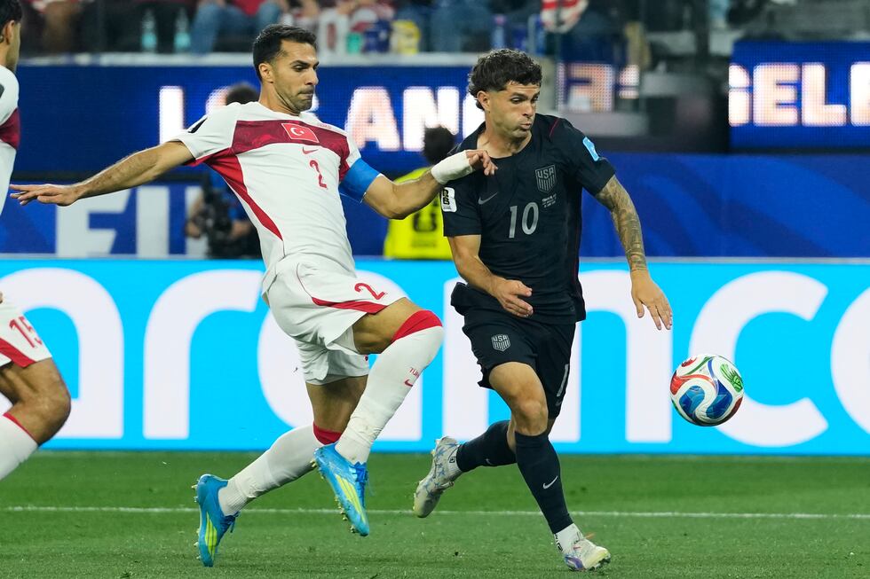 United States' Christian Pulisic (10) and Turkey's Zeki Celik battle for the ball during the...