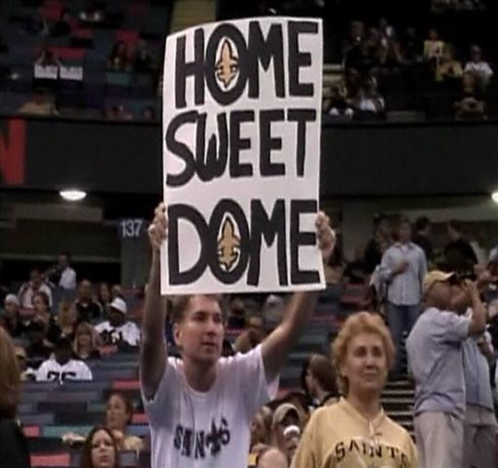 Fans with "Home Sweet Dome" banner during first game at newly rebuilt Superdome, New Orleans,...