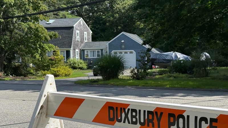 A police barricade stands outside the former home of Lindsay Clancy in Duxbury, Mass., on...