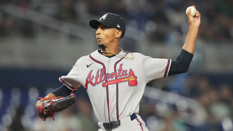 Atlanta Braves starting pitcher Ray Kerr throws during the first inning of a baseball game,...