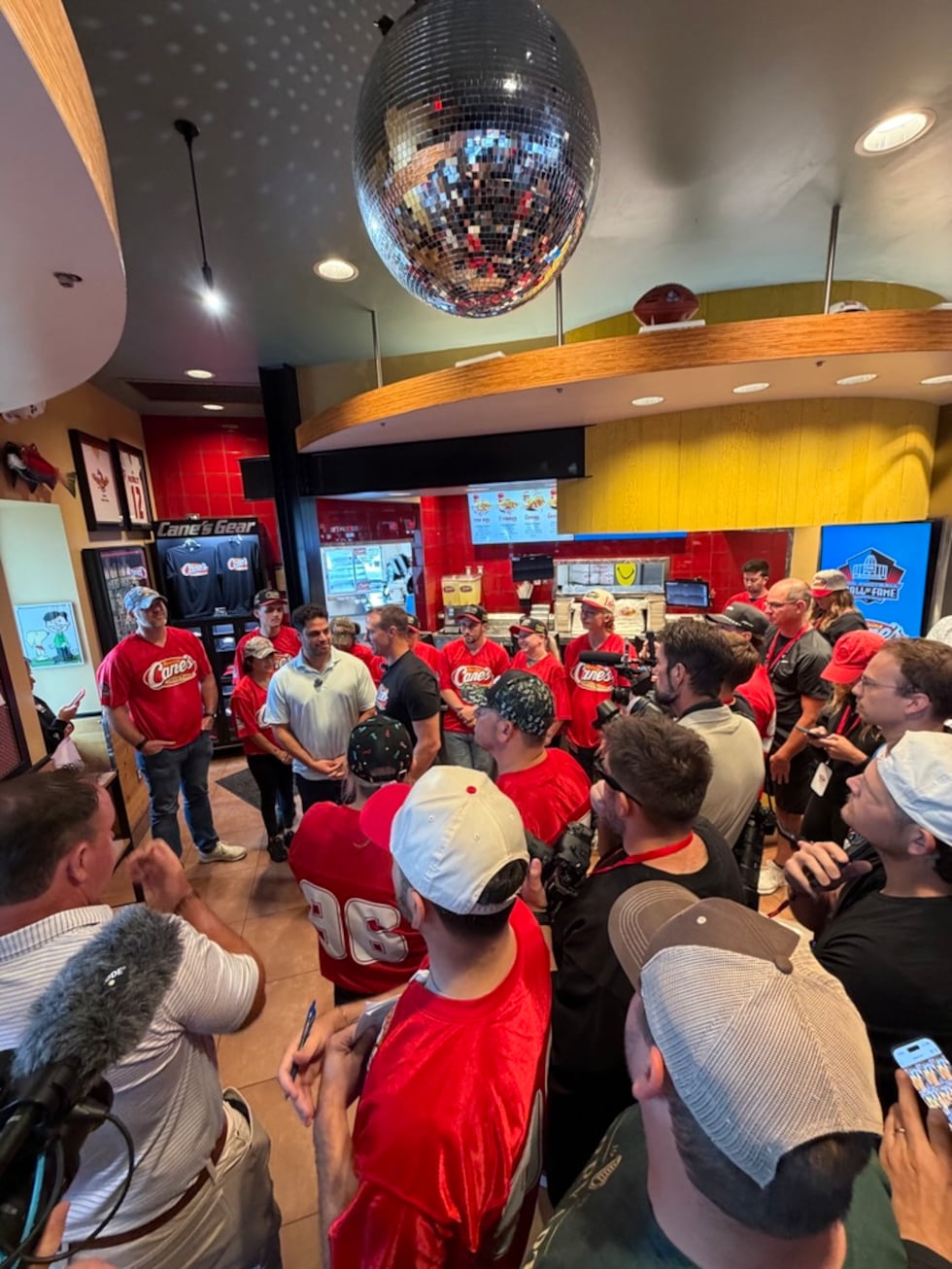 Fans pack a Raising Cane’s in Canton as Drew Brees works a shift during Hall of Fame weekend.