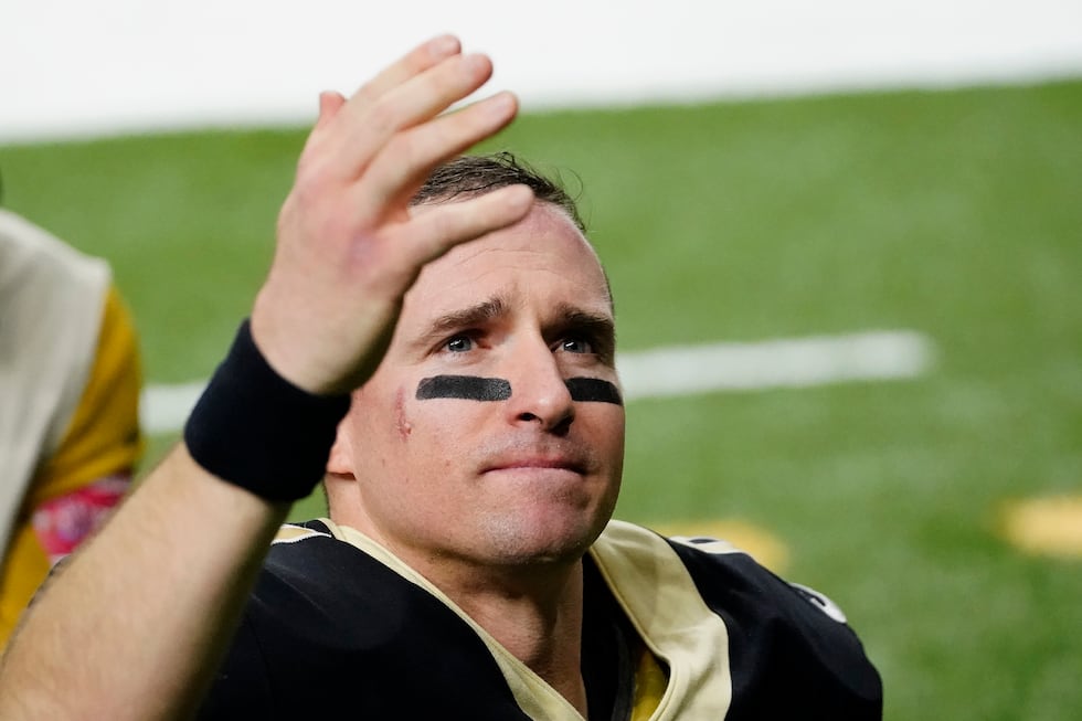 New Orleans Saints quarterback Drew Brees waves to his family and fans after an NFL divisional...