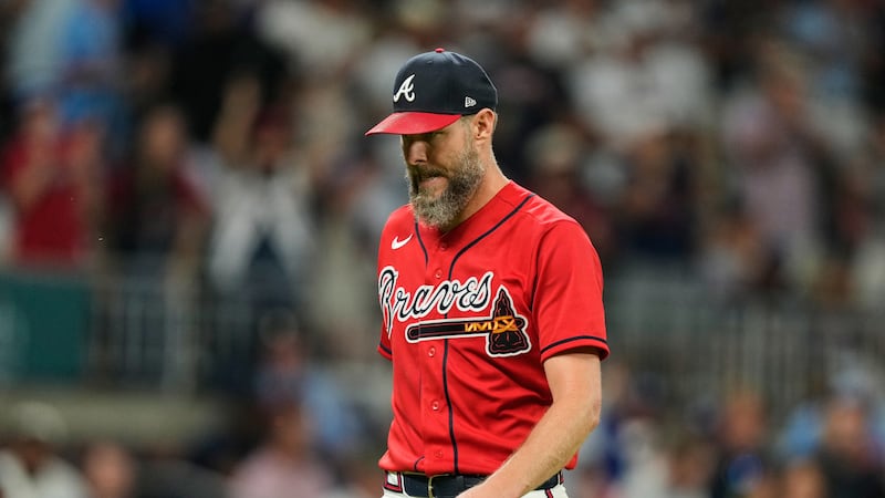 Atlanta Braves pitcher Chris Sale walks to the dugout after working against the Los Angeles...