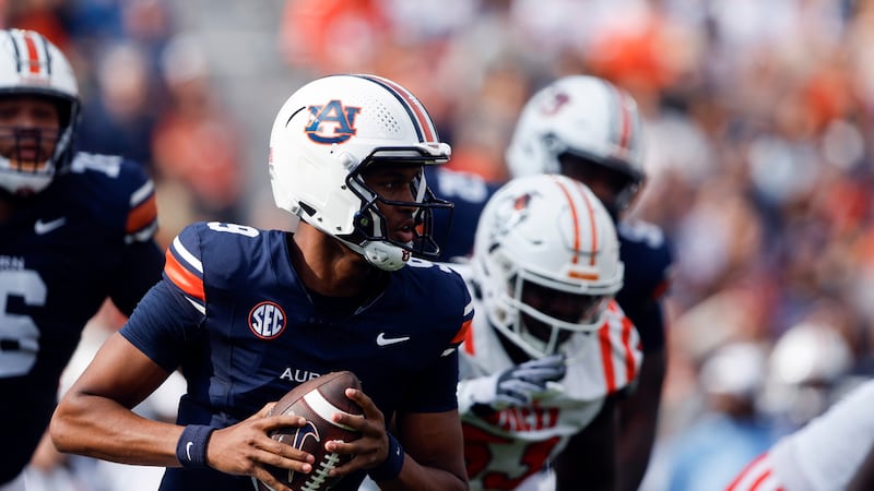 Auburn quarterback Deuce Knight (9) scrambles and carries for a touchdown against Mercer...