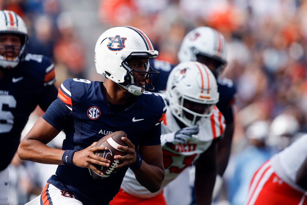 Auburn quarterback Deuce Knight (9) scrambles and carries for a touchdown against Mercer...