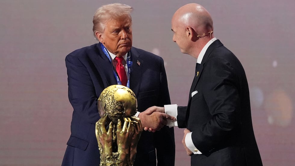 President Donald Trump receives the FIFA Peace Prize from FIFA President Gianni Infantino...