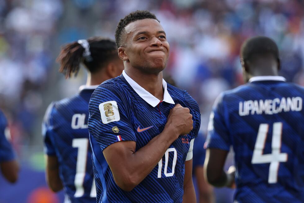 France's Kylian Mbappe (10) celebrates scoring their third goal during the World Cup round of...
